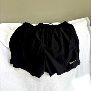 Men’s Size Medium black Nike running shorts.